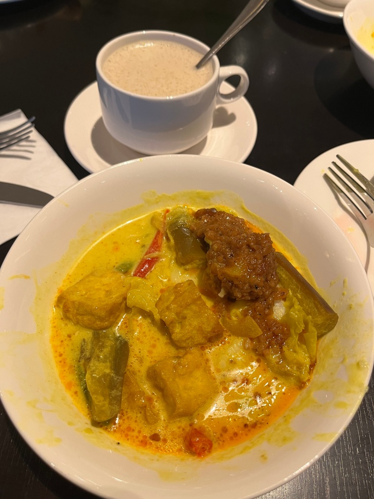 Malaysian food which is nasi impit, kuah lodeh and kuah kacang